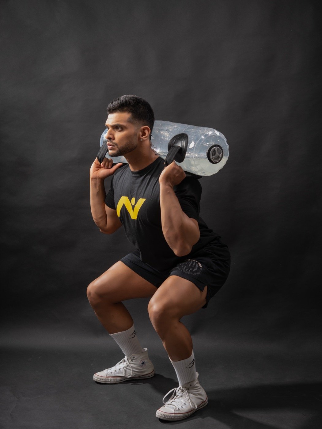 SNC Planet coach training with a water-filled resistance bag